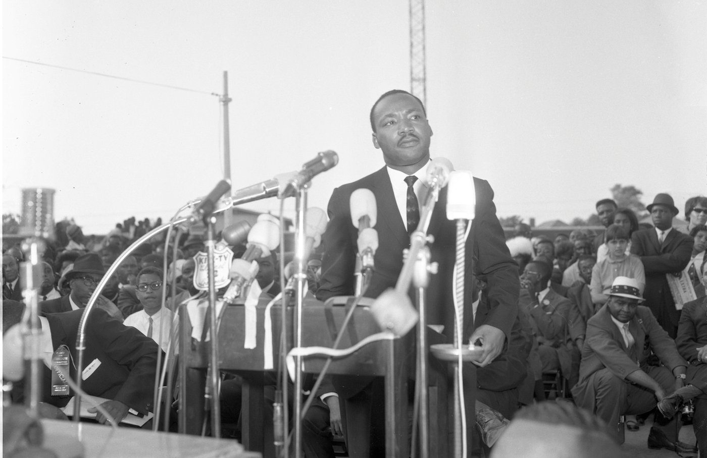 Dr. King in front of a variety of microphones at Freedom Rally, Wrigley Field, Los Angeles