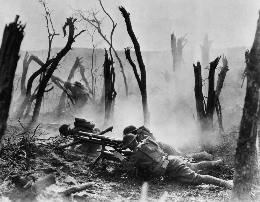 U.S. Army Infantry division laying on the ground in the midst of fighting,  France 1918.