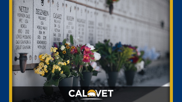 A photo of flowers set up against inurnments at the California Central Coast Veterans Cemetery.